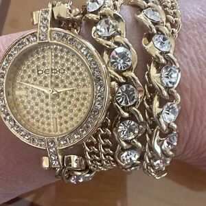 Bebe Gold Toned Watch with Crystal Embellishments